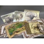 A set of six Kwa Zulu Natal made placemats printed with wild animals, a pan holder and a quantity of