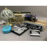 A quantity of gadgets including card holder lights, hand hotties, Kodak Avantix camera, Roberts