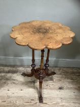 A Victorian figured walnut occasional table, circular with scalloped rim, inlaid to the centre