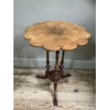 A Victorian figured walnut occasional table, circular with scalloped rim, inlaid to the centre