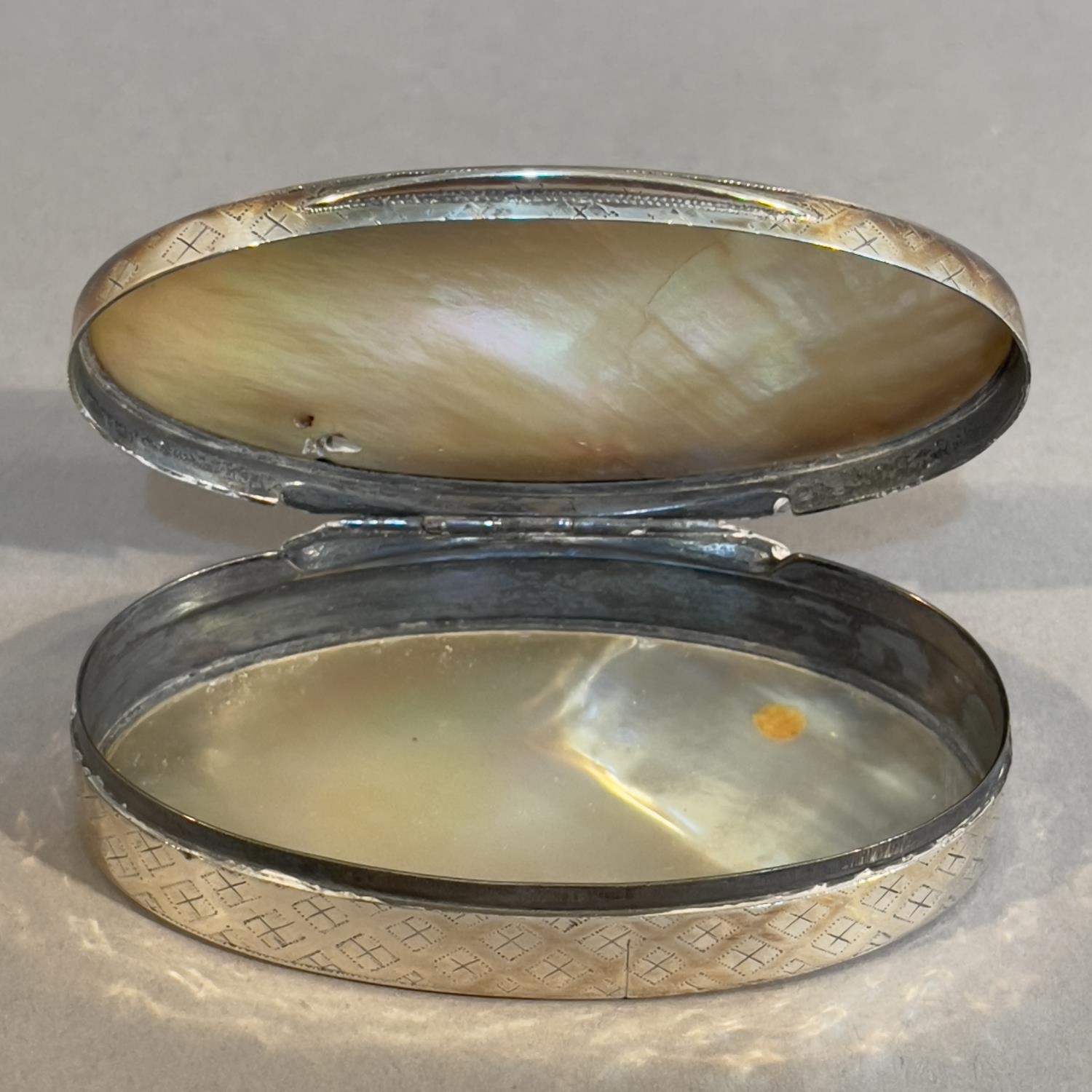 A late 19th century silver and mother of pearl; snuff box, oval, the sides embossed with a trellis - Image 2 of 3