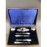 A George V seven piece silver manicure set, Birmingham 1919, all of indented outline and in original