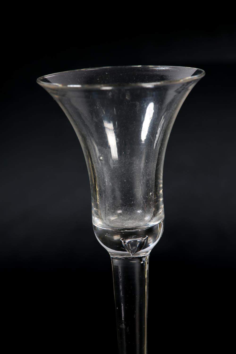 An 18th century wine glass, c1780, the ogee bowl etched with flower and leaves, on plain stem, domed - Image 3 of 5
