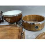 A book trough, twin handle wooden tray, two wooden bowls with plated mounts