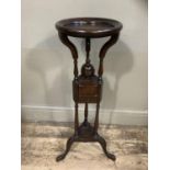 A reproduction mahogany wig stand with two drawers