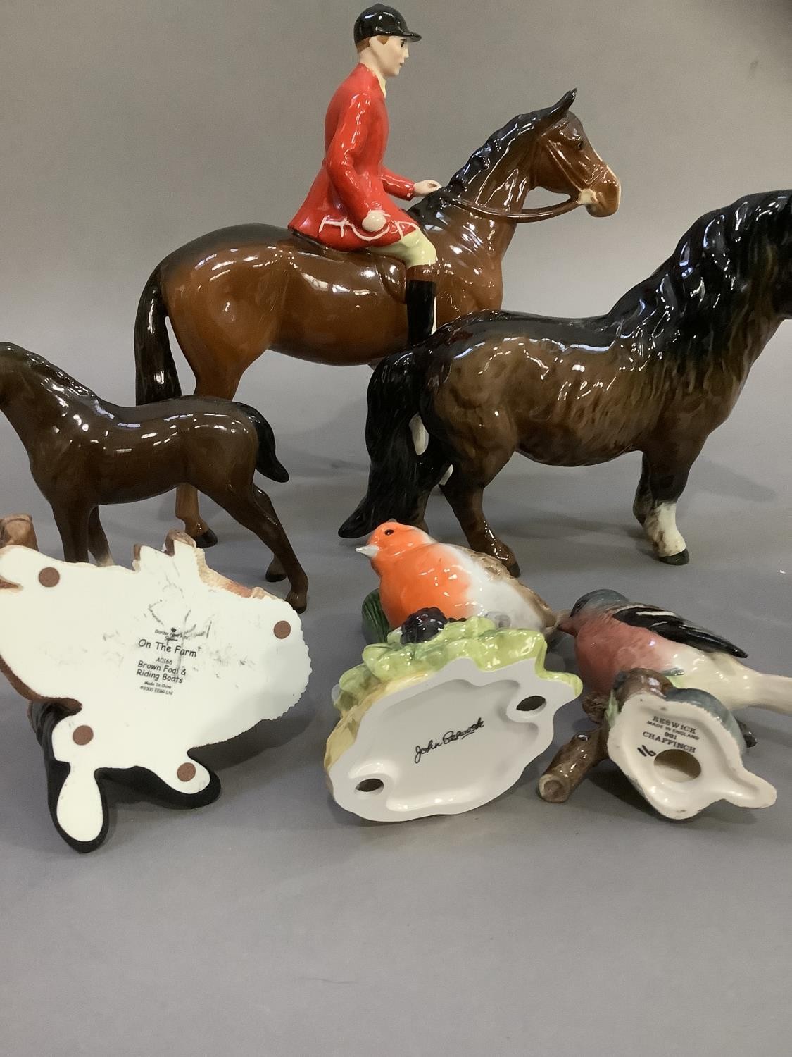 A Beswick huntsman and horse, a Shetland pony and a donkey foal, a chaffinch and a robin beside a - Image 3 of 7