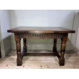A Titchmarsh and Goodwin oak drawer leaf extending dining table on turned legs joined by an 'H'