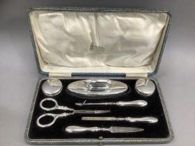 A George V silver seven piece manicure set, Chester 1924, for Stokes and Ireland Ltd, plain polished