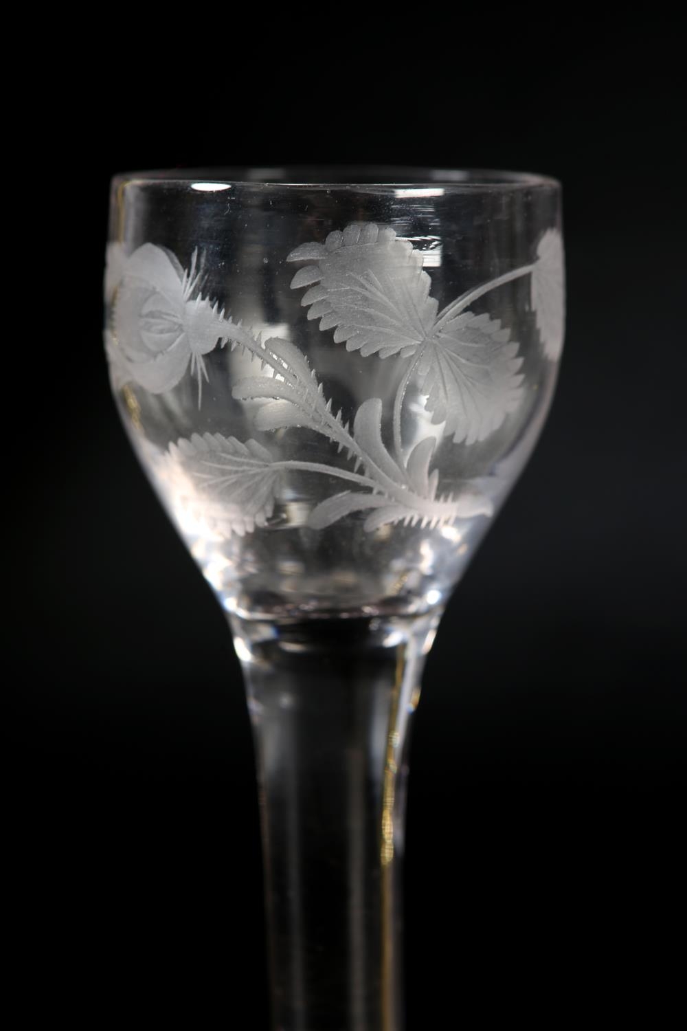 An 18th century wine glass, c1780, the ogee bowl etched with flower and leaves, on plain stem, domed - Image 5 of 5