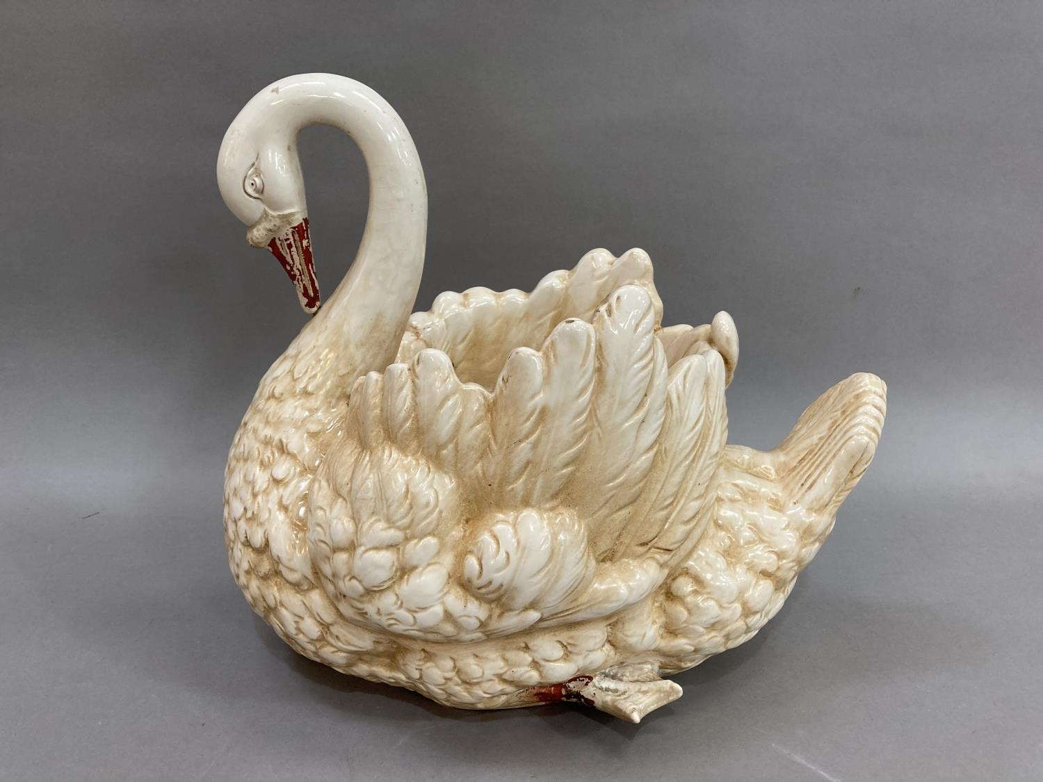 A large pottery model of a swan as a jardiniere 34.5cm high