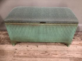 A Lloyd Loom green blanket box with upholstered seat, together with an ebonised folding table