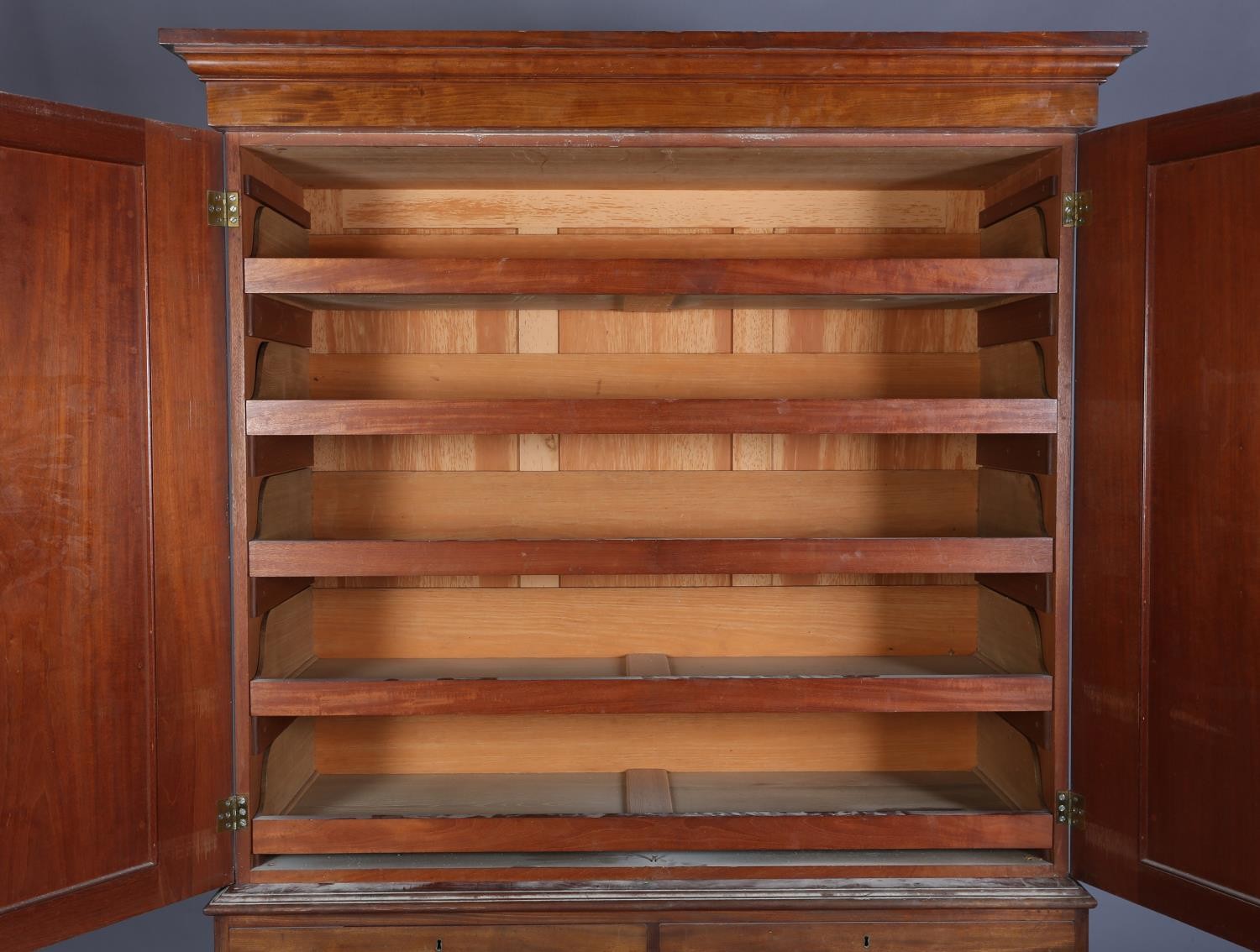 A 19th century mahogany clothes press, having a moulded cornice above two indented panel doors, - Image 4 of 5