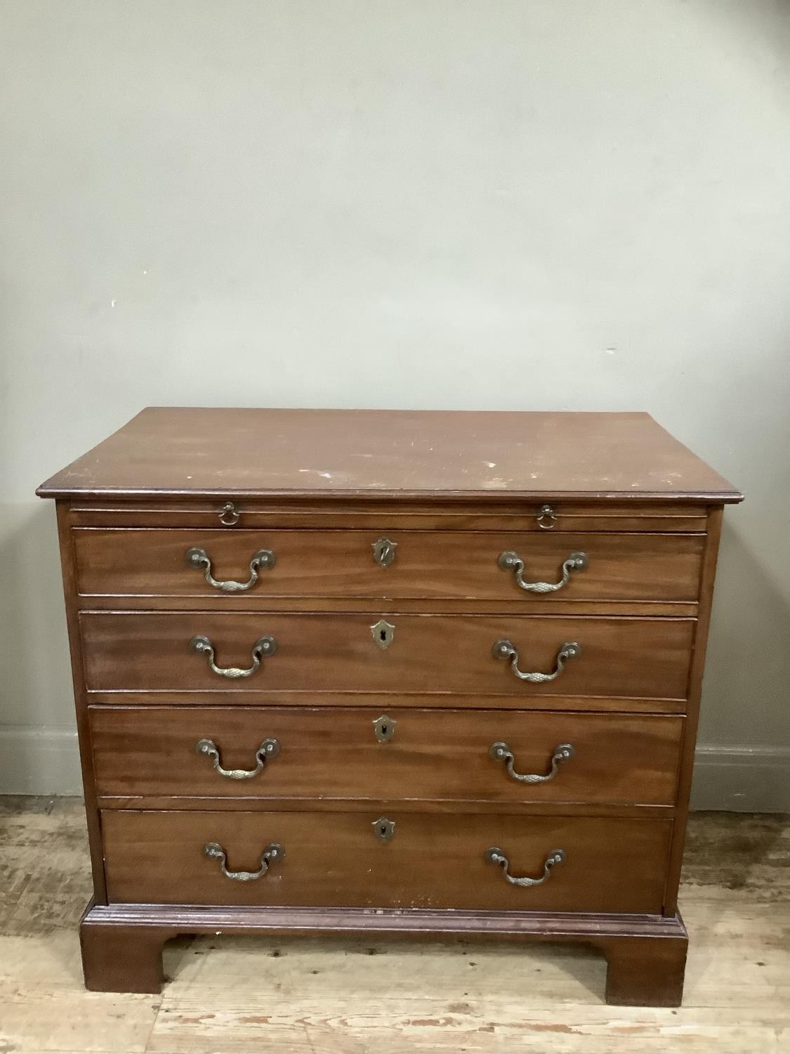 A mahogany bachelor's chest of four graduated drawers and on bracket feet, 92cm wide, 82cm high