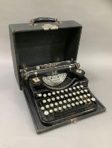 A Vintage Underwood Standard portable typewriter black enamelled with gilt lettering complete with