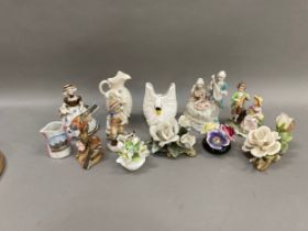 A collection of porcelain including posies, a swan vase, a Royal Worcester figure group of
