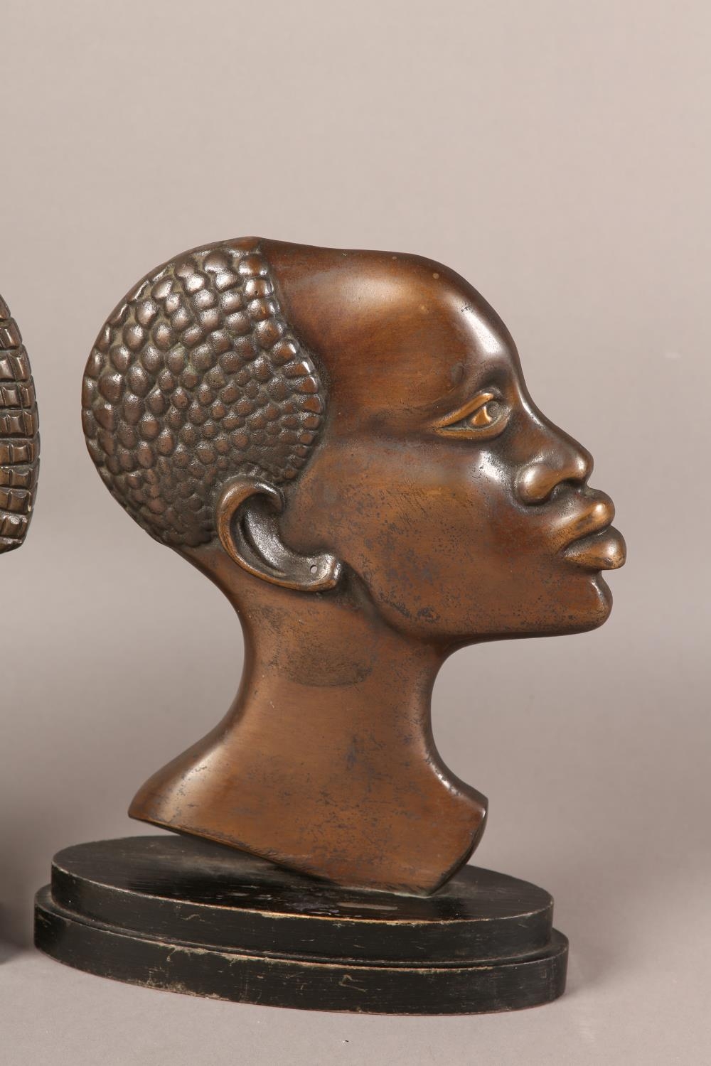 Two early 20th century bronze profiles of an African tribesman and woman, after Hagenau, coppered - Image 3 of 4