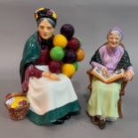 A Royal Doulton ' The Old Balloon Seller' 18cm high and 'The Family Album' figures