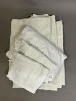 A pair of Irish white linen flat bed sheets, two cotton aprons, a cotton nightgown with double