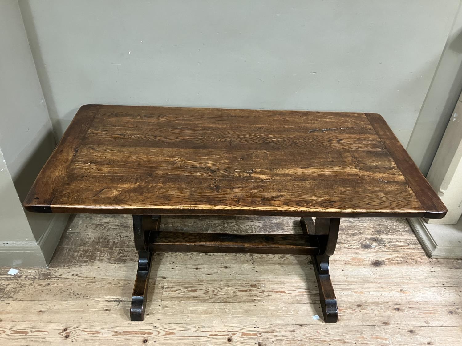 An oak refectory dining table on shaped standards and platform stretcher, 150cm x 74cm - Image 2 of 3