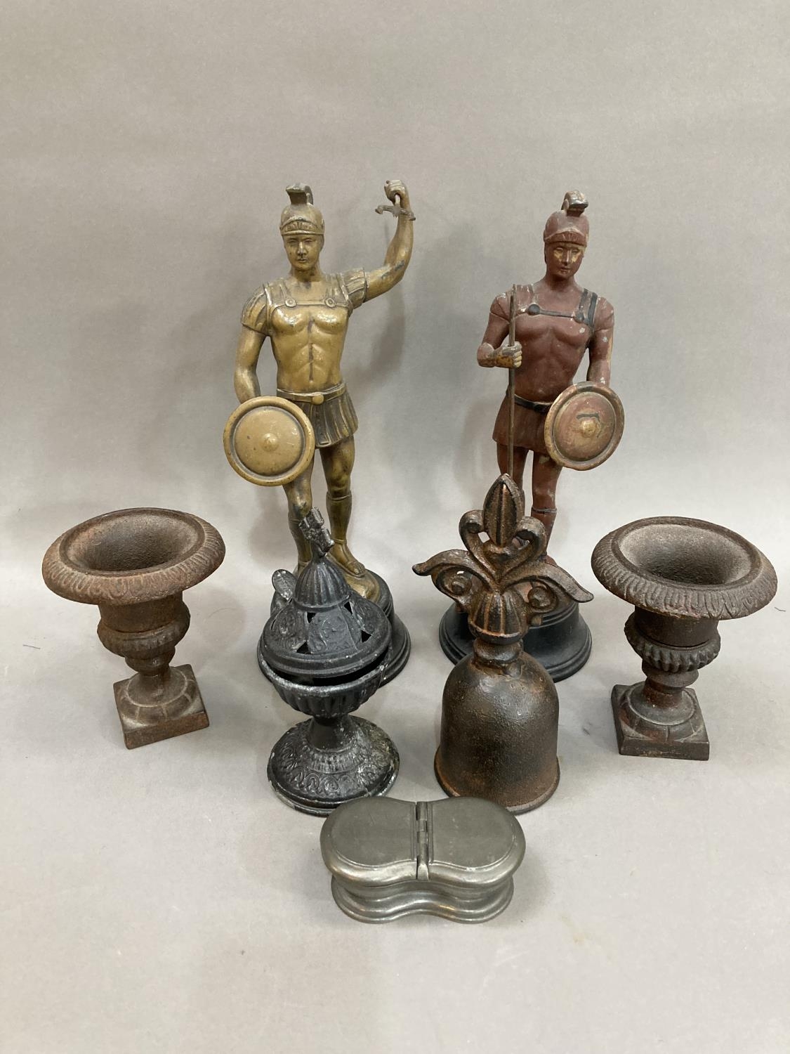 Two metal figures of Greek soldiers, a pair of metal Campana urns, a bell, an incense urn, a