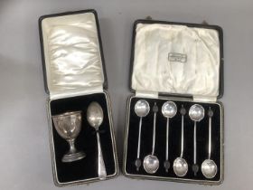 A George V composite set of silver egg cup and spoon, Birmingham 1932 and 1933, plain with stepped