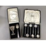 A George V composite set of silver egg cup and spoon, Birmingham 1932 and 1933, plain with stepped