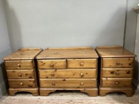 A modern pine chest of two short above three long drawers together with two bedside cabinets of