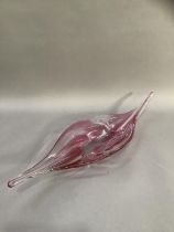 A 1970s studio tinted pink and clear glass dish of elongated form, 63cm wide