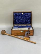 A 19th century walnut work box with lozenge banding, mother of pear escutcheon and cartouche, the