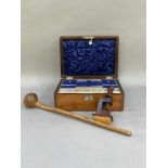 A 19th century walnut work box with lozenge banding, mother of pear escutcheon and cartouche, the