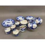 A late Victorian blue and white tea service, detailed in gilt and comprising twelve cups and