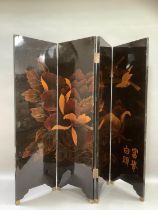 A four fold black lacquered chinoiserie screen