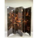 A four fold black lacquered chinoiserie screen