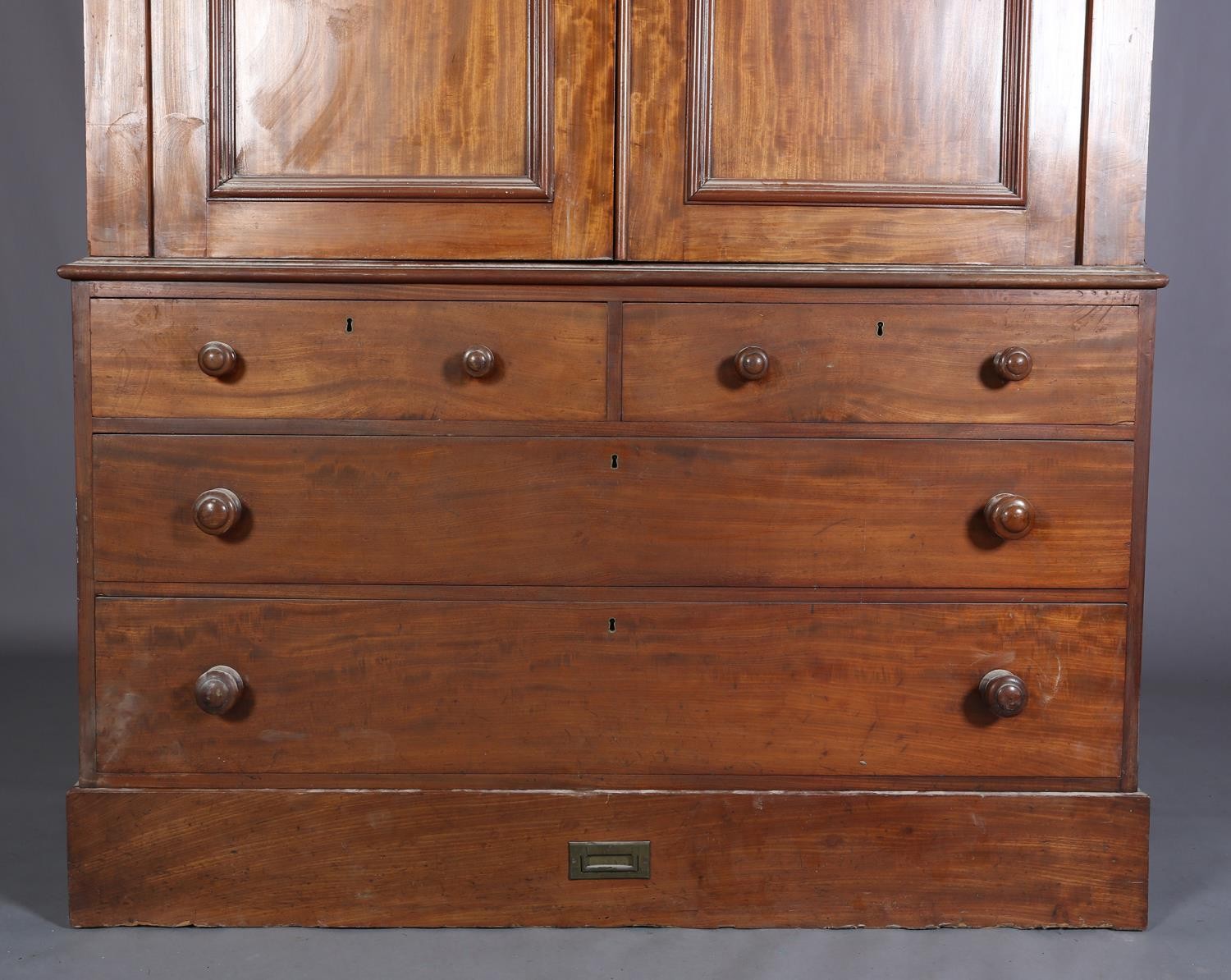 A 19th century mahogany clothes press, having a moulded cornice above two indented panel doors, - Image 2 of 5