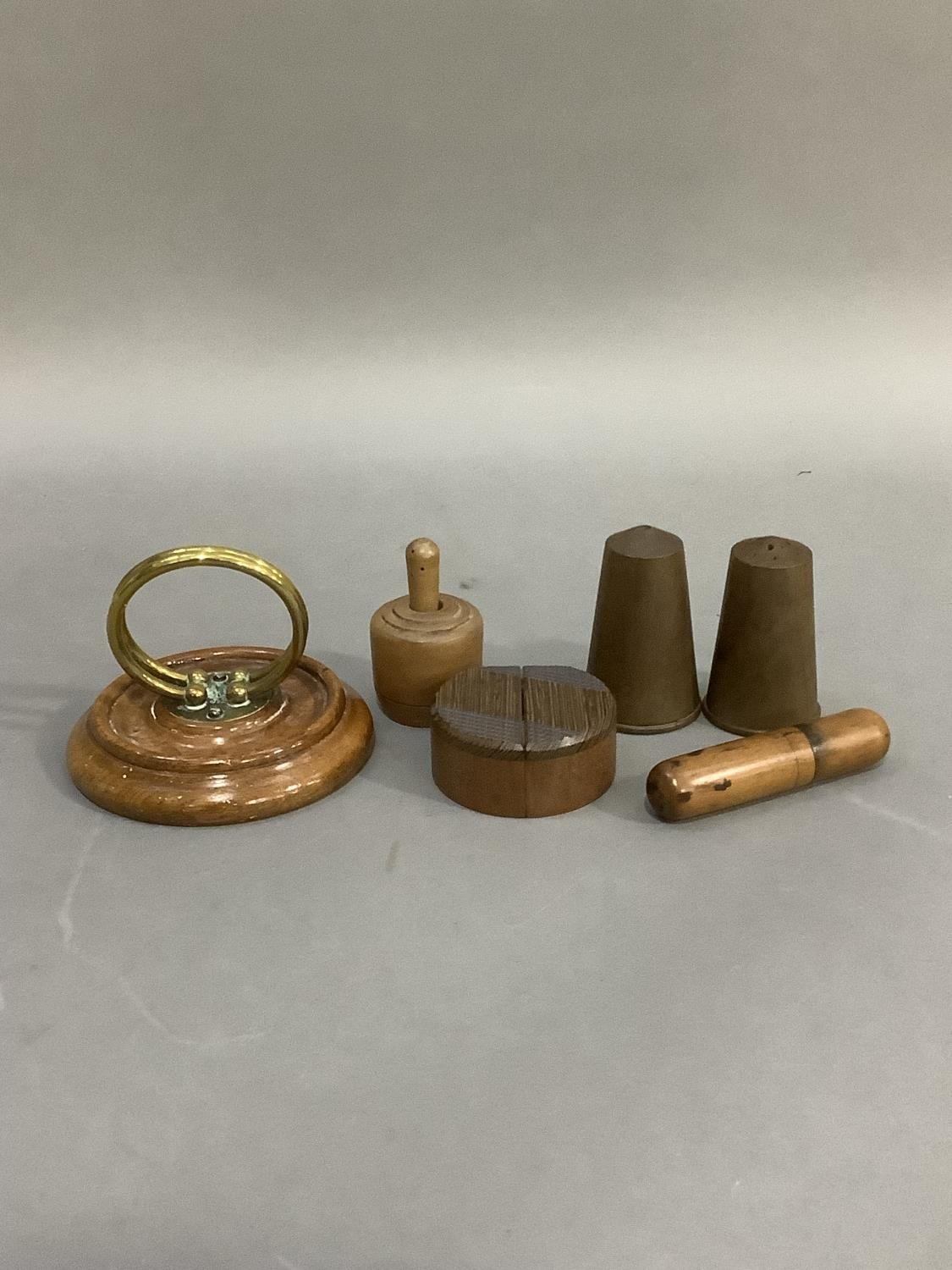 A Victorian oak and brass ring letter holder, a pine butter mould, treen holder, a pair of 1960s