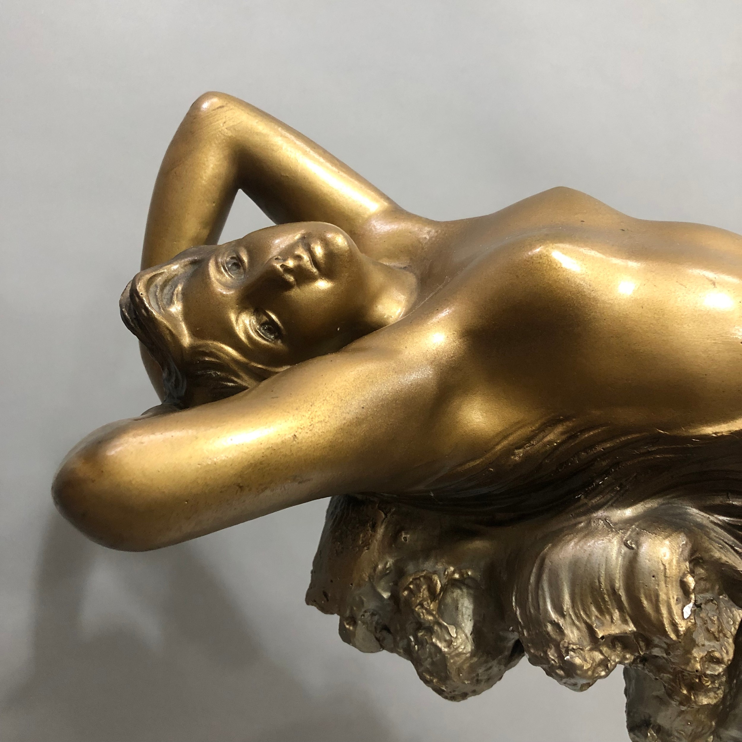 An Art Deco gilded plaster table lamp modelled as a nude female reclining on the crest of a wave - Image 2 of 2