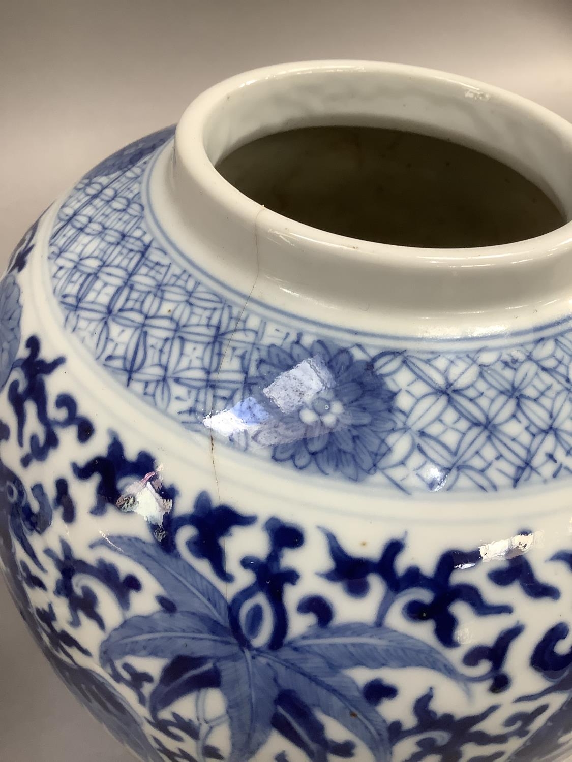 A Chinese ginger jar of ovoid form painted in underglaze blue with opposing pairs of phoenix below a - Image 3 of 3