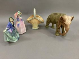 A Royal Doulton figure, Miss Demure, another 'Sweet Anne', a Royal Worcester style elephant and a