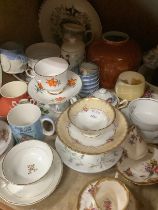 A collection of cabinet cups and saucers with other ceramics