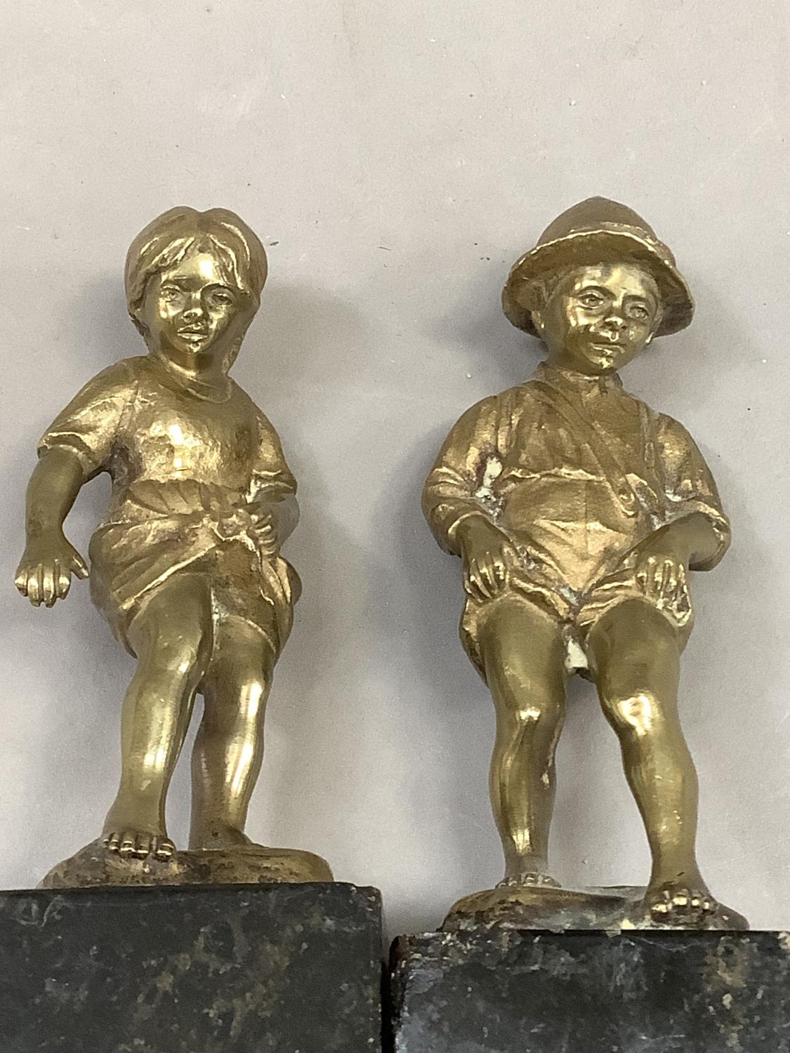 After Perot, a pair of 19th century brass sculptures of a boy and girl paddling raised on black - Image 3 of 3