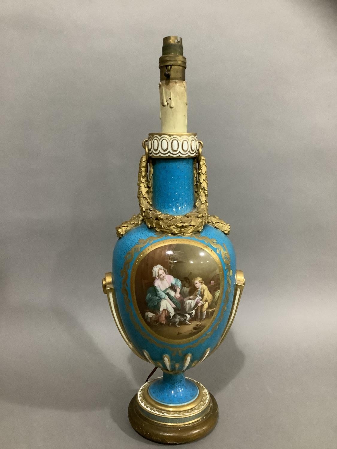 A French Sevres style vase converted to a lamp, the ovoid body painted with a mother and child in
