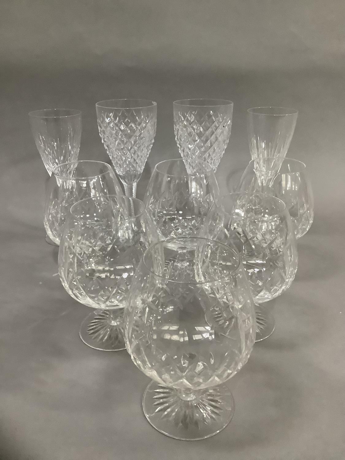 A set of six Stuart crystal balloon brandy glasses, two hobnail cut glass wines and two Stuart