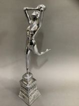 An Art Deco style chrome figure of girl with ball on moulded base, 43cm high