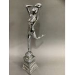 An Art Deco style chrome figure of girl with ball on moulded base, 43cm high