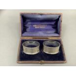 A pair of Queen Elizabeth II silver napkin rings Birmingham 1962 for Crisford and Norris Ltd, engine