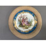 A Sevres style porcelain plaque, painted with a romantic scene of a lovers in a landscape within a