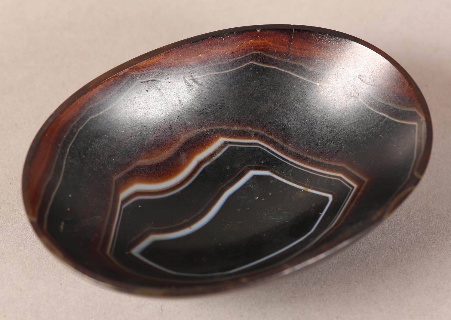 A banded agate bowl of oval outline on foot rim, 9cm wide x 6.5cm deep x 2.75cm high (two cracks - Image 3 of 4