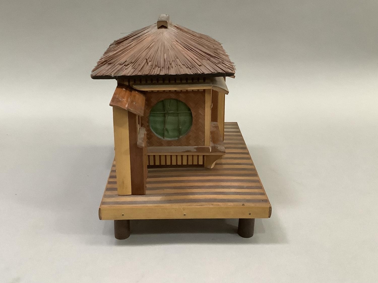 Model of a Japanese house raised on a platform and with bamboo feet. 23.5cm wide x 15.5cm deep x - Image 2 of 3