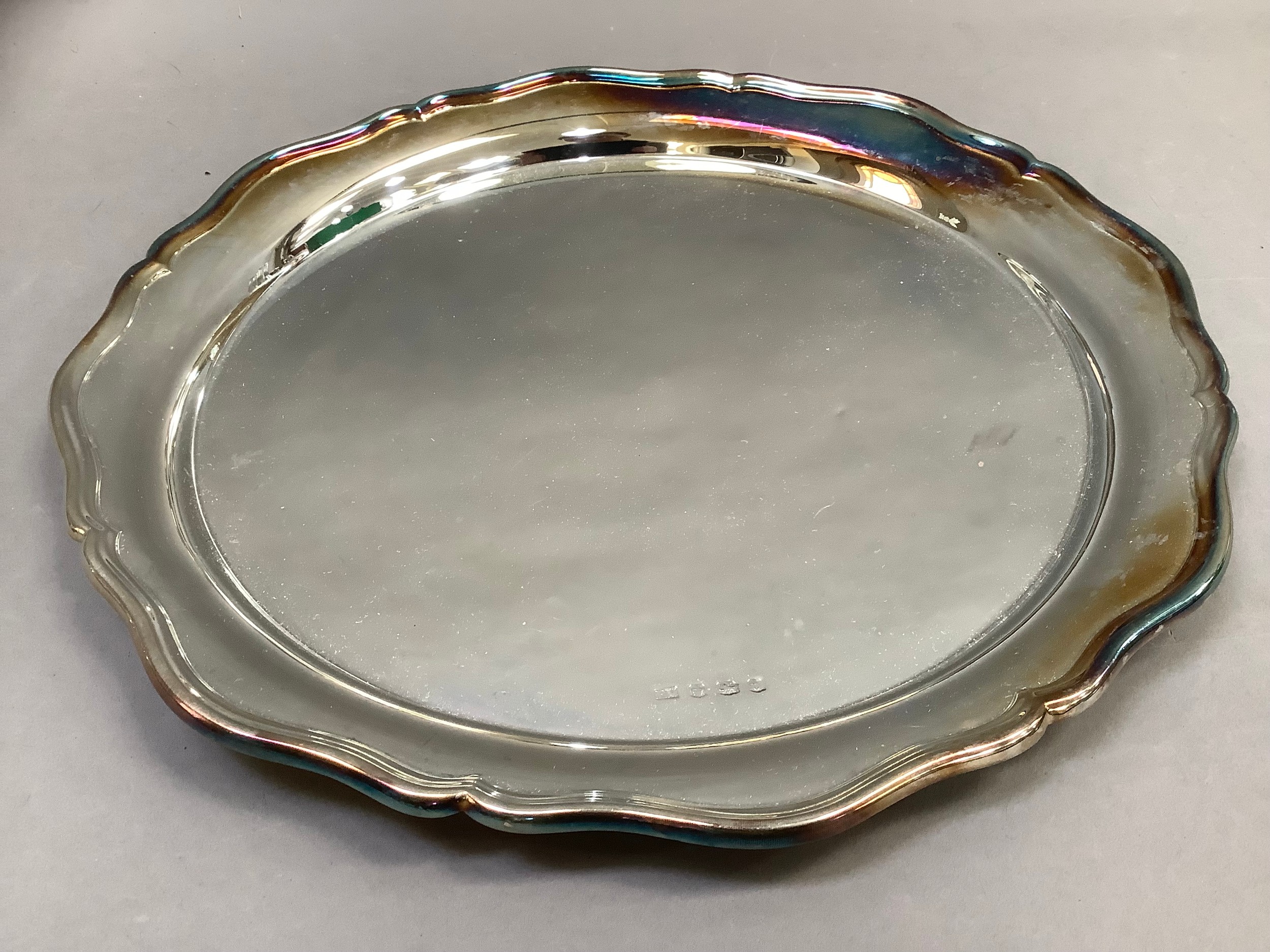 A George V silver tray, Sheffield 1936 for Viners Ltd, of circular outline, bracketed rim,