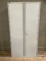 A grey metal filing cabinet with two doors